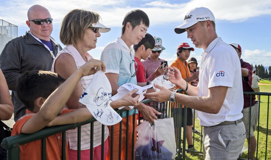 KAPALUA, MAUI, HI - JANUARY 07: Justin Thomas signs autographs for fans after the third round of the SBS Tournament of Champions at Plantation Course at Kapalua on January 7, 2017 in Kapalua, Maui, Hawaii. (Photo by Stan Badz/PGA TOUR)