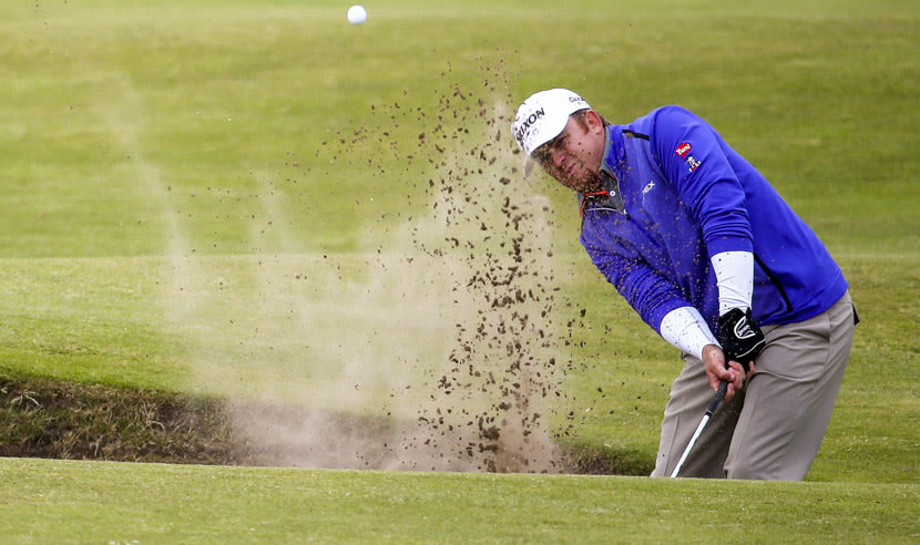 ST ANDREWS, SCOTLAND - JULY 16: JB Holmes of the United States plays his second shot from a bunker on the 4th hole during the first round of the 144th Open Championship at The Old Course on July 16, 2015 in St Andrews, Scotland.  (Photo by Matthew Lewis/Getty Images)