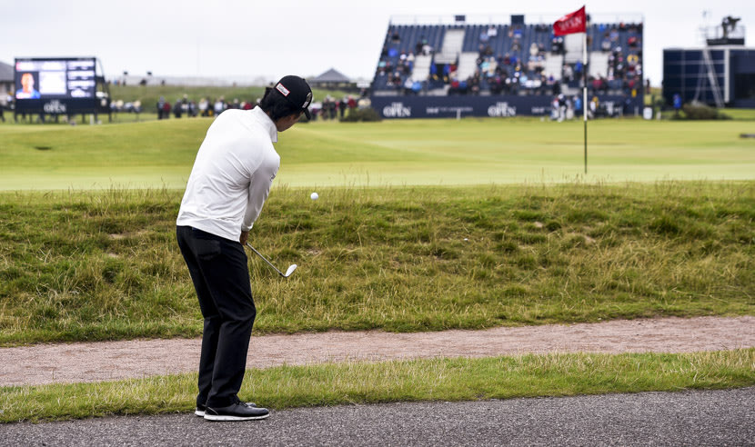 ST ANDREWS, SCOTLAND - JULY 16: Kevin Na of the United States chips onto the 17th green during the first round of the 144th Open Championship at The Old Course on July 16, 2015 in St Andrews, Scotland.  (Photo by Stuart Franklin/Getty Images)