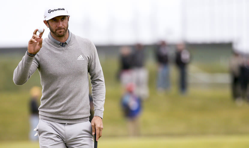ST ANDREWS, SCOTLAND - JULY 16: Dustin Johnson of the United States salutes the crowd on the 15th green during the first round of the 144th Open Championship at The Old Course on July 16, 2015 in St Andrews, Scotland.  (Photo by Mike Ehrmann/Getty Images)