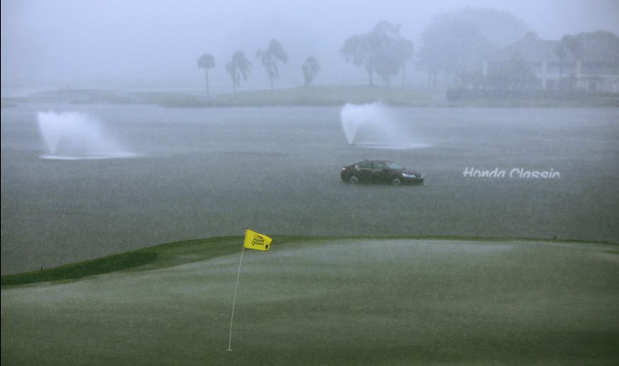 PALM BEACH GARDENS, FL - FEBRUARY 28:  The 18th green is under water as play is suspended for the day due to severe weather during the third round of The Honda Classic at PGA National Resort & Spa - Champion Course on February 28, 2015 in Palm Beach Gardens, Florida.  (Photo by David Cannon/Getty Images)