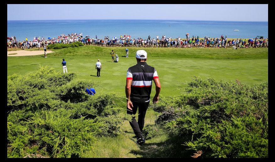 SHEBOYGAN, WI - AUGUST 14: Rickie Fowler of the United States walks back onto the course after playing a shot from the cart path on the 2nd hole during the second round of the 2015 PGA Championship at Whistling Straits on August 14, 2015 in Sheboygan, Wisconsin.  (Photo by Tom Pennington/Getty Images)