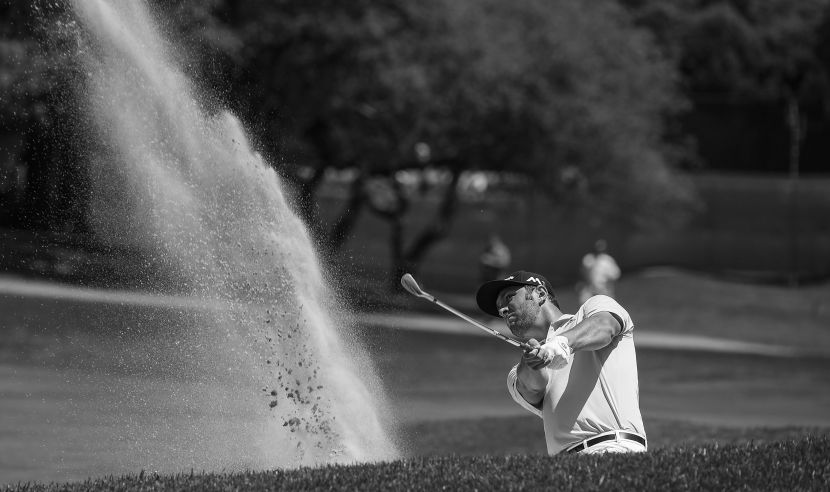 BETHESDA, MD - JUNE 25: (EDITOR'S NOTE: This image has been converted to black and white) Jon Rahm of Spain hits out of a bunker on the first hole during the third round of the Quicken Loans National at Congressional Country Club (Blue) on June 25, 2016 in Bethesda, Maryland. (Photo by Stan Badz/PGA TOUR)