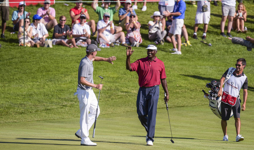BETHESDA, MD - JUNE 25:  Vijay Singh of Fiji celebrates with Webb Simpson after making a putt from off the green on the 18th hole during the third round of the Quicken Loans National at Congressional Country Club (Blue) on June 25, 2016 in Bethesda, Maryland. (Photo by Stan Badz/PGA TOUR)