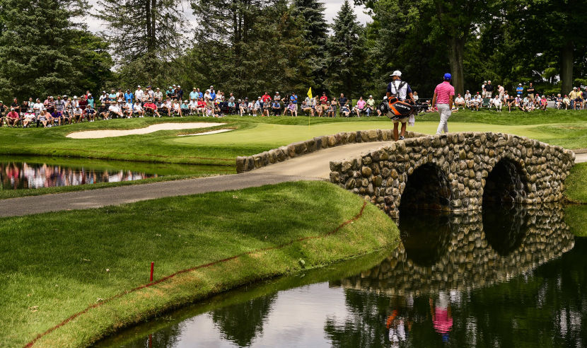 AKRON, OH - JULY 02: Rickie Fowler and his caddy walks across the bridge the third hole during the third round of the World Golf Championships-Bridgestone Invitational at Firestone Country Club on July 2, 2016 in Akron, Ohio. (Photo by Ryan Young/PGA TOUR)