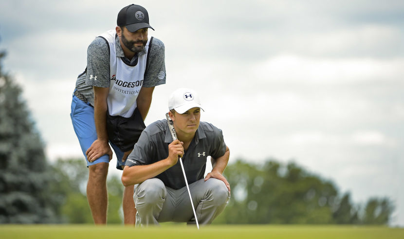AKRON, OH - JULY 02:  Jordan Spieth lines up a putt on the 4th green with caddie Michael Greller during the third round of the World Golf Championships-Bridgestone Invitational at Firestone Country Club on July 2, 2016 in Akron, Ohio. (Photo by Chris Condon/PGA TOUR)
