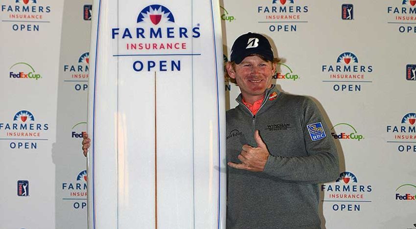 Brandt Snedeker with the totally inappropriate surfboard trophy at Farmers