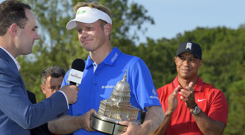 BETHESDA, MD - JUNE 26: Billy Hurley III holds the winner's trophy as Tiger Woods looks on after the final round of the Quicken Loans National at Congressional Country Club (Blue) on June 26, 2016 in Bethesda, Maryland. (Photo by Stan Badz/PGA TOUR)
