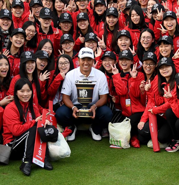 Hideki Matsuyama with WGC trophy and many fans